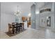 Open-concept living space with dining area, kitchen, and living room with natural light at 333 Sonoma Valley Cir, Orlando, FL 32835