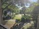Overgrown backyard with a gazebo enhances the scenic backyard at 3446 Soho St # 108, Orlando, FL 32835