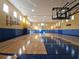 This is an interior shot of a bright and spacious indoor basketball court at 3446 Soho St # 108, Orlando, FL 32835