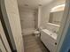 Bathroom featuring tiled tub and shower, modern vanity and tile floors at 3446 Soho St # 108, Orlando, FL 32835