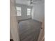 A bright bedroom with tile flooring and a ceiling fan at 3446 Soho St # 108, Orlando, FL 32835