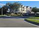 Exterior view of the community featuring a community sign and parking lot at 3446 Soho St # 108, Orlando, FL 32835