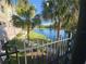 Serene lake view framed by lush palm trees, offering a tranquil and scenic backdrop at 3446 Soho St # 108, Orlando, FL 32835