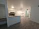Open concept living area with modern tile flooring, white trim, and abundant natural light at 3446 Soho St # 108, Orlando, FL 32835