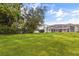 Lush green backyard offers plenty of space for outdoor activities and relaxation, creating a serene retreat at 3534 Woodley Park Pl, Oviedo, FL 32765