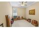 Bedroom with a window, a ceiling fan and moving boxes at 3534 Woodley Park Pl, Oviedo, FL 32765