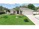 Beautiful one-story home boasts a well-manicured lawn, vibrant landscaping, and a two-car garage at 3534 Woodley Park Pl, Oviedo, FL 32765