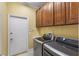 Laundry room featuring front-load washer and dryer at 3534 Woodley Park Pl, Oviedo, FL 32765
