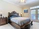 Relaxing bedroom retreat with private access to the lanai, and a ceiling fan at 3534 Woodley Park Pl, Oviedo, FL 32765