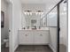 Stylish bathroom with a double sink vanity, modern fixtures, and a glass-enclosed shower at 4409 Lions Gate Ave, Clermont, FL 34711