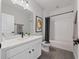 Well-lit bathroom features a single vanity, a large mirror and a combined tub and shower at 4409 Lions Gate Ave, Clermont, FL 34711
