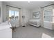 Bright Bedroom with white crib, rocking chair, patterned curtains, and decor at 4409 Lions Gate Ave, Clermont, FL 34711