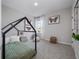 bedroom featuring a modern canopy bed frame and butterfly themed decor at 4409 Lions Gate Ave, Clermont, FL 34711