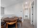 Upstairs hallway with a wood table and chairs next to the stairwell at 4409 Lions Gate Ave, Clermont, FL 34711