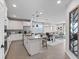 Open-concept kitchen with stainless steel appliances and dining area at 4409 Lions Gate Ave, Clermont, FL 34711
