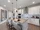 Contemporary kitchen with island seating, stainless appliances, and modern finishes at 4409 Lions Gate Ave, Clermont, FL 34711