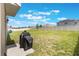 Large backyard featuring a covered grill, sunny skies and a fence for privacy at 4644 Bernard Blvd, Haines City, FL 33844