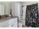 Bathroom featuring a granite vanity top, a shower and tub combination and a modern sink at 4644 Bernard Blvd, Haines City, FL 33844