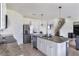 Modern kitchen with stainless steel appliances, granite countertops, a large island, and tile flooring at 4644 Bernard Blvd, Haines City, FL 33844