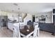 Open floor plan featuring a dining area, living room, and modern kitchen with stainless appliances at 4644 Bernard Blvd, Haines City, FL 33844