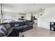 Cozy living room with a large sofa and open access to the kitchen and dining area at 4644 Bernard Blvd, Haines City, FL 33844
