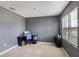 Office area with carpeted floors and a window bringing natural light to the workspace at 4644 Bernard Blvd, Haines City, FL 33844