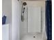 Walk-in shower with a detachable shower head and a built-in bench at 4644 Bernard Blvd, Haines City, FL 33844