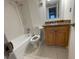 Standard bathroom featuring a single sink with granite countertops, toilet, and a shower and tub combo at 4701 S Texas Ave # 4701A, Orlando, FL 32839