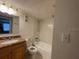 Standard bathroom featuring a single sink with granite countertops, toilet, and a shower and tub combo at 4701 S Texas Ave # 4701A, Orlando, FL 32839