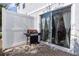 Cozy back patio with grill and sliding glass doors for seamless indoor/outdoor living at 4733 Cliveden Loop, Sanford, FL 32773