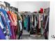 Walk-in closet with ample hanging space for clothes, shoes, and accessories on shelves and racks at 4733 Cliveden Loop, Sanford, FL 32773