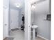 Inviting entryway featuring a convenient powder room and a coat rack with a bench and shoe storage at 4733 Cliveden Loop, Sanford, FL 32773