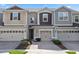 Charming townhome featuring a two-car garage, brick driveway, and beautifully landscaped front yard at 4733 Cliveden Loop, Sanford, FL 32773