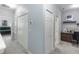 Upstairs hallway with bedroom and office access, storage closets and carpet flooring at 4733 Cliveden Loop, Sanford, FL 32773