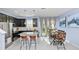 Bright kitchen and dining area with island, granite countertops and backyard access at 4733 Cliveden Loop, Sanford, FL 32773