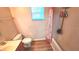 Functional bathroom with shower and tub combination with wood-look flooring at 4905 Newton Ct, St Cloud, FL 34771