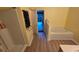 Bright bathroom features a soaking tub and separate shower with wood-look flooring at 4905 Newton Ct, St Cloud, FL 34771
