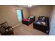 This shared room features two beds and wood-look flooring at 4905 Newton Ct, St Cloud, FL 34771