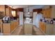 Spacious kitchen with wooden cabinets, granite countertops, a central island, and stainless steel appliances at 4905 Newton Ct, St Cloud, FL 34771