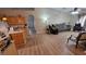 This kitchen features granite counters, wood floors and seamlessly flows into the living area at 4905 Newton Ct, St Cloud, FL 34771