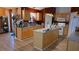 Bright eat-in kitchen featuring granite countertops, an island, stainless appliances, and wooden cabinets at 4905 Newton Ct, St Cloud, FL 34771