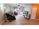 Inviting living room with wood floors, a ceiling fan, neutral paint and a large window at 4905 Newton Ct, St Cloud, FL 34771