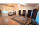 Open living room with vaulted ceilings, a ceiling fan, wood floors and neutral paint at 4905 Newton Ct, St Cloud, FL 34771