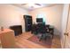 Efficient home office with computer, storage, and wood-look flooring at 4905 Newton Ct, St Cloud, FL 34771