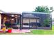 Covered patio with outdoor dining and bar-b-que, as well as screened-in porch with hot tub at 4905 Newton Ct, St Cloud, FL 34771