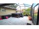 The screened patio features a hot tub, string lights and plenty of room for outdoor seating at 4905 Newton Ct, St Cloud, FL 34771