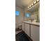 Bright bathroom featuring a modern vanity and toilet at 513 Bailey Cir, Davenport, FL 33897