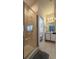 Bright bathroom featuring a glass enclosed shower and a white vanity at 513 Bailey Cir, Davenport, FL 33897