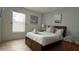 Cozy bedroom with a queen-size bed, comfortable linens, and warm natural light at 513 Bailey Cir, Davenport, FL 33897