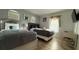 Bedroom featuring two beds, light wood floors, and modern wall decor at 513 Bailey Cir, Davenport, FL 33897